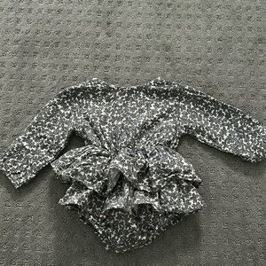 Floral one piece with ruffles and button details!